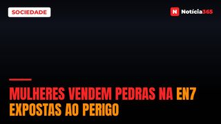 Mulheres vendem pedras na EN7 expostas ao perigo